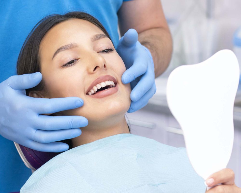 satisfied patient at the dentist. who demonstrates his perfect smile after treatment at the clinic